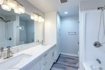 Large, totally remodeled bathroom with double vanity and large linen closet.