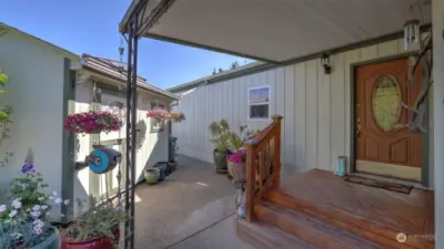 Expansive covered front porch welcomes you home.