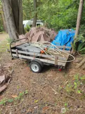 Utility trailer included in list price.