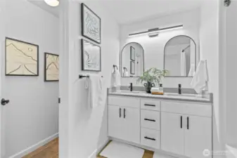 Remodeled full bathroom situated between 3 upstairs bedrooms.