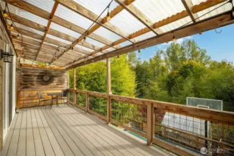 Elongated balcony off of living room and kitchen