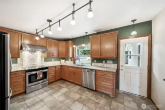 The kitchen's bay window makes it easy to grow your own fresh herbs for meals.