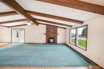 Living Room's beautiful exposed beams and vaulted ceiling add to its airy feeling. The pellet stove insert has recently been serviced.