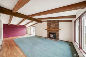 Patio slider grants access to the front deck overlooking the fully fenced front yard.