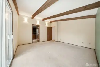 Primary bedroom also has access to the deck to enjoy the fully fenced backyard.