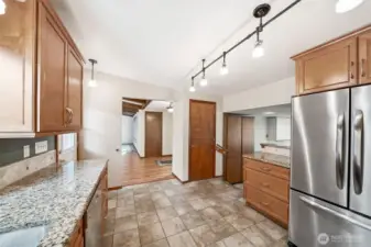 Back to the other side of the home, down a couple of steps to the right you'll find a large office space.