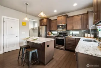 This kitchen has plenty of counter space and bar seating!