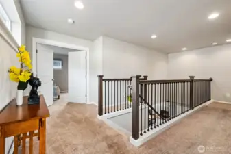 Spacious upper landing that can serve as a reading nook, desk space, or bonus area.