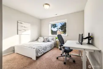 Bright secondary bedroom ideal for guests, a home office, or study space.