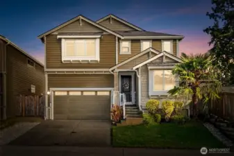 Stunning twilight exterior that highlights the home’s curb appeal and warm ambiance.
