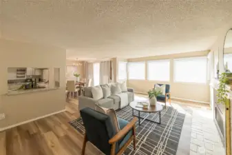 Light-filled living room with large picture windows.