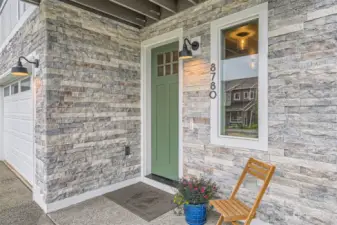 Beautiful stacked stone and  covered front entry.