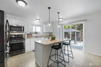 Eat in Kitchen with sliding doors leading to outside.