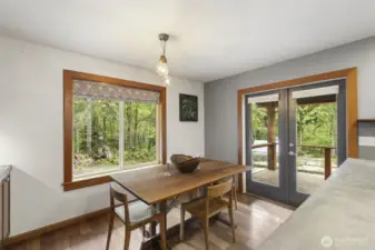 Dining room, great views and French doors to large, covered back deck.