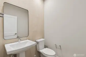 Main floor half bath. Photos are for representational purposes only.  Colors and options may vary.