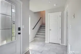 Entrance foyer with garage access and large storage.