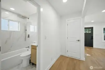 Peek into the bathroom, tile-drenched.