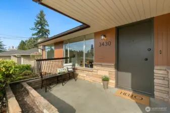 The front of this home is screaming for a deck or covered patio!