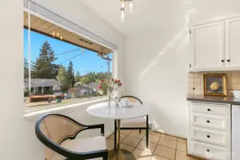 This eating nook is the perfect spot to have coffee. Imagine french doors and a deck right off of this space.