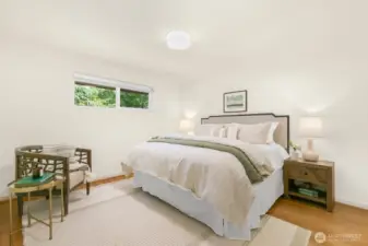 The primary bedroom is on the south end of the home and is large enough for a king-size bed, large furniture, and a seating area!