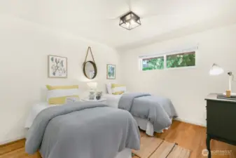 The last of three bedrooms on the main - easily fits two twin beds and dresser.