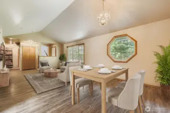 ATTRACTIVE LIVING ROOM, WITH VAULTED CEILINGS AND BRIGHT WINDOWS.
