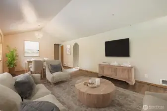 BRIGHT AND PLEASANT LIVING ROOM WITH ABUNDANT NATURAL LIGHT.