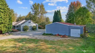 1,152 SF SHOP W/ POWER, DUAL ROLL-UP DOORS & 528 SF COVERED STORAGE AREA.