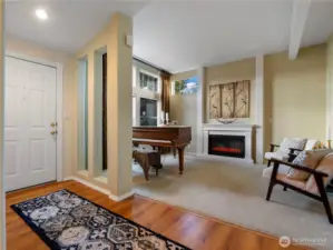 The warm inviting living room welcomes you in.