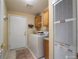 Laundry room is conveniently located between the hall way and the garage. Newer furnace and AC with high efficiency.