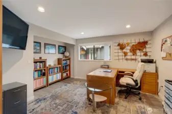 Bedroom used as an office. Closet doors in garage.