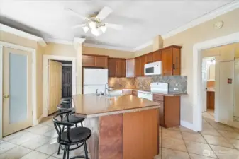 Straight ahead the door leads into the third bedroom as well as the designated laundry room.
