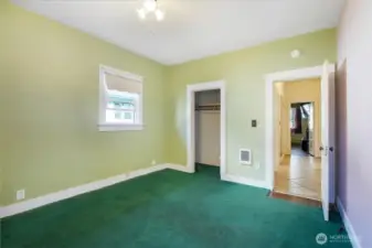 Bedroom 1 with view of closet and hallway.