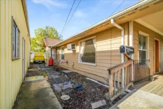 Between home and hobbies! The path between the home and the gigantic shop. Leads to the man door for the shop and the alley for even more parking!