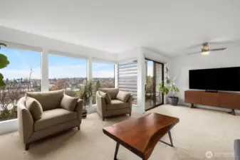 Entertain, unwind, and take in the views—this spacious great room opens to the balcony and the city beyond.