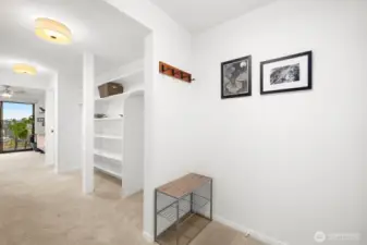 Where home begins—this chic entry hallway with built-in storage nooks keeps life beautifully organized.