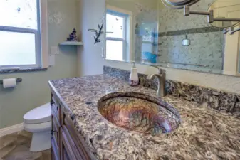 Custom Glass sinks in Granite countertops.