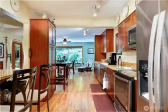 A view from the kitchen looking toward the additional dining space or family room.