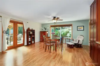 Additional space for dining, entertaining, family room, or whatever suits your needs. Note the additional pair of French doors to the covered deck outside.