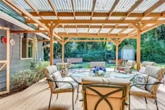 Wonderful covered deck off of the kitchen/dining areas.