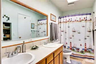 The full bathroom off the hallway to the primary bedroom.