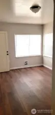 East facing upper unit provides natural morning light-updated flooring