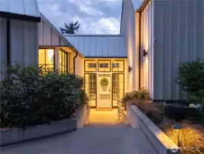 The entry welcomes you with a large dutch door and glass surround.