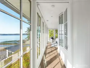 Entering the primary suite through walls of glass.