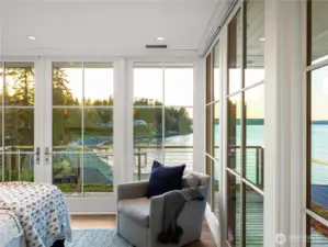 The primary suite with wraparound deck balcony. All windows have automatic blackout shades for the perfect night sleep.