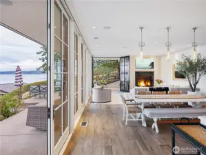 Step into the great room with kitchen, dining and living room and floor to ceiling Pella glass windows and doors for seamless transitions from inside to out.