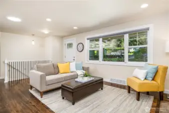 Looking back towards the front door. Stairs to the lower level are in the back left.