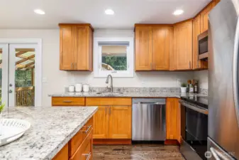 Tons of counter space and lovely views out back for cheerful dishwashing.