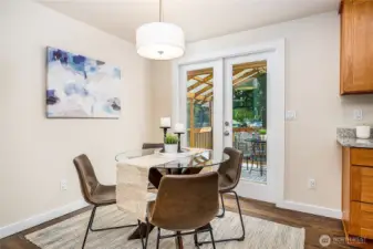Dining area with French Doors leading to the covered patio outside.