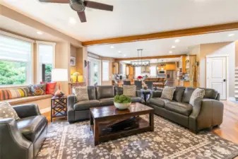 Great room concept with spacious living. Custom window seat to left of frame.